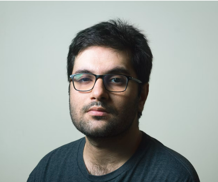 Man in glasses looking at camera